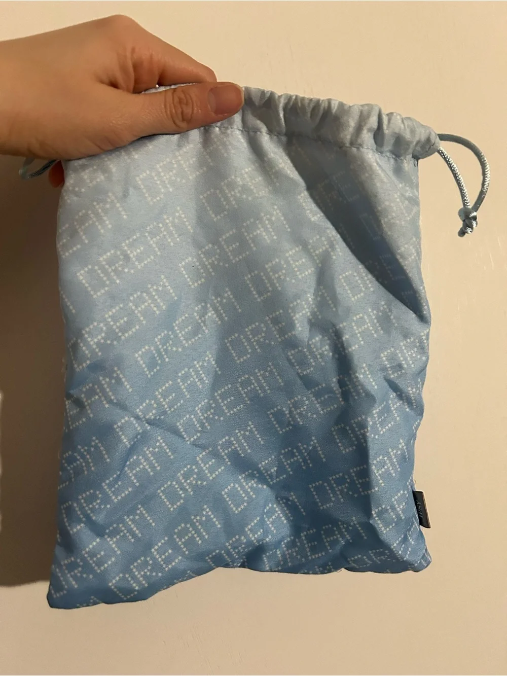 Light Blue Drawstring Pouch with 'DREAM' Pattern